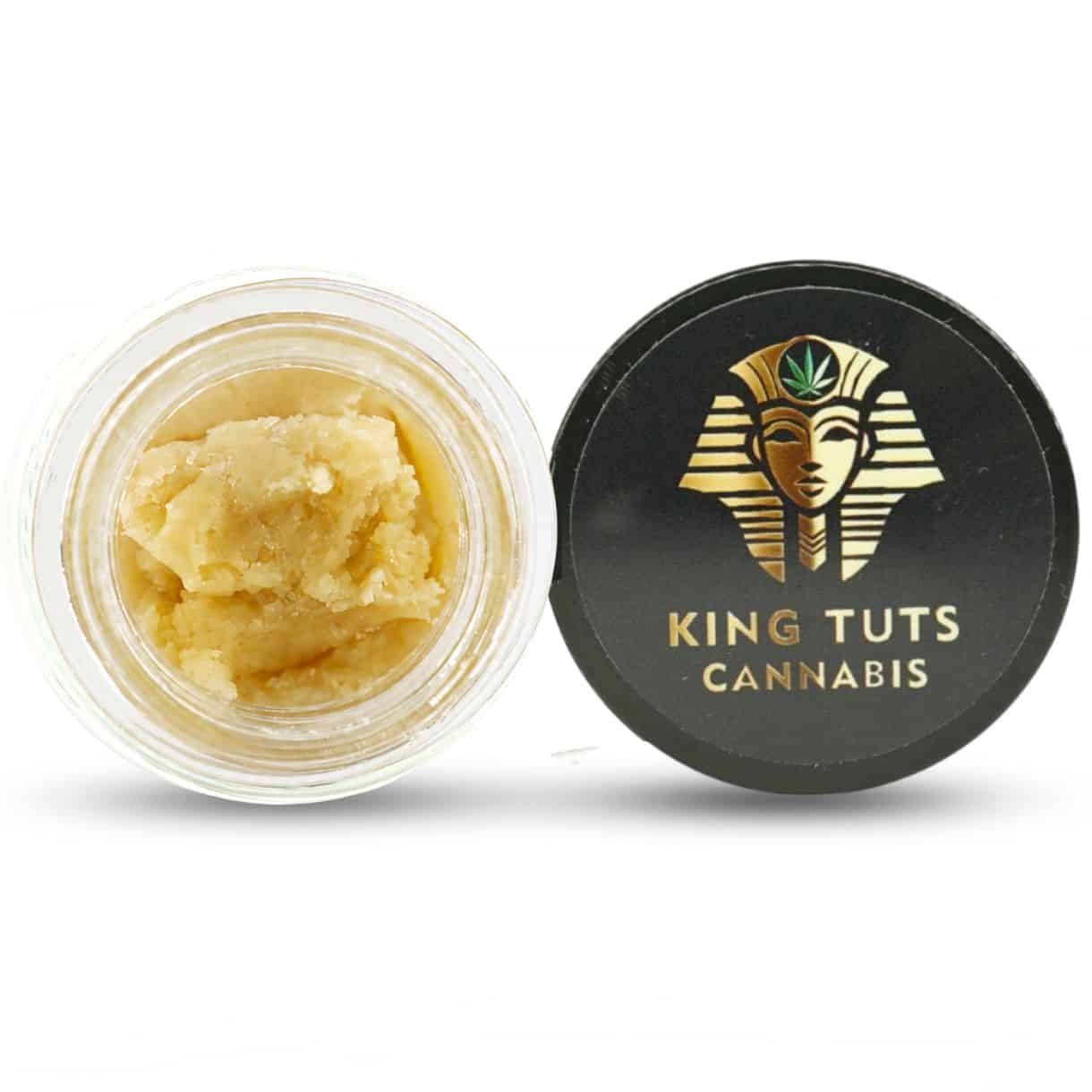 blueberry dream Open container of light-golden cannabis concentrate with a creamy, whipped texture beside a King Tuts Cannabis branded lid on a white background.