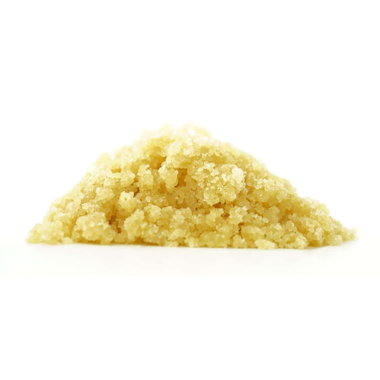 killer queen Golden cannabis sugar wax concentrate photographed on a crisp white background with visible crystal texture and natural depth
