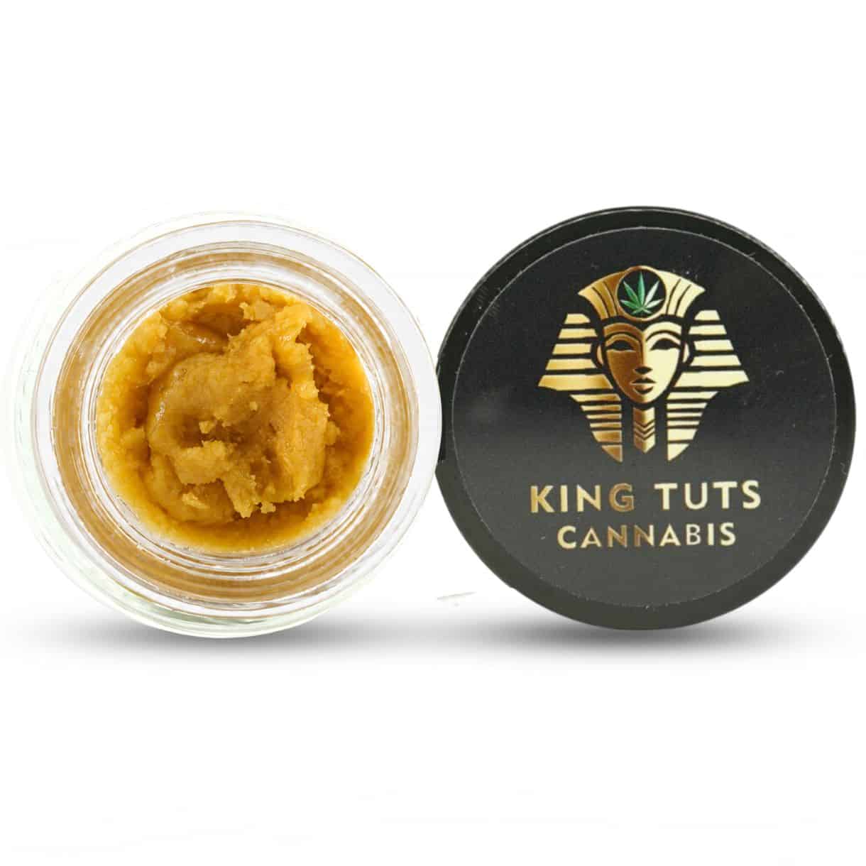 may tai cookies budder Open container of light-golden cannabis concentrate with a creamy, whipped texture beside a King Tuts Cannabis branded lid on a white background.