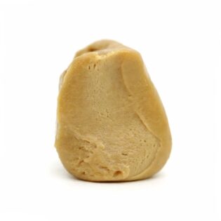 Photorealistic close-up of a light beige resin concentrate with smooth texture and natural contours on a crisp white background.