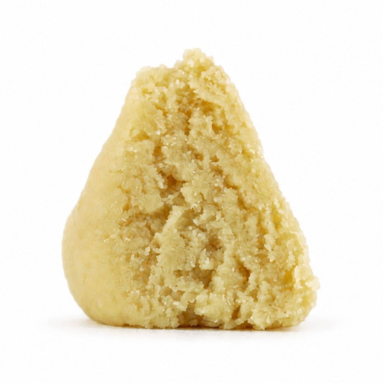 east coast sour diesel budder Close-up Pale yellow cannabis extract with a crumbly texture displayed upright on a white background