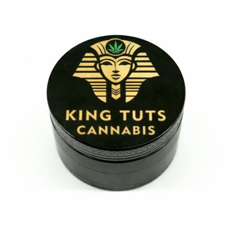 King Tuts Cannabis black metal grinder with gold logo on white background