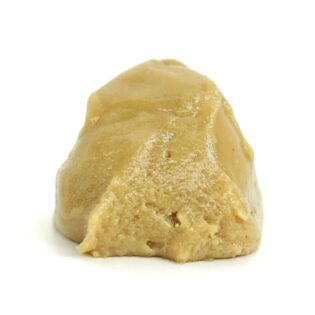 Golden cannabis budder concentrate on a white background, showcasing its smooth, creamy texture.