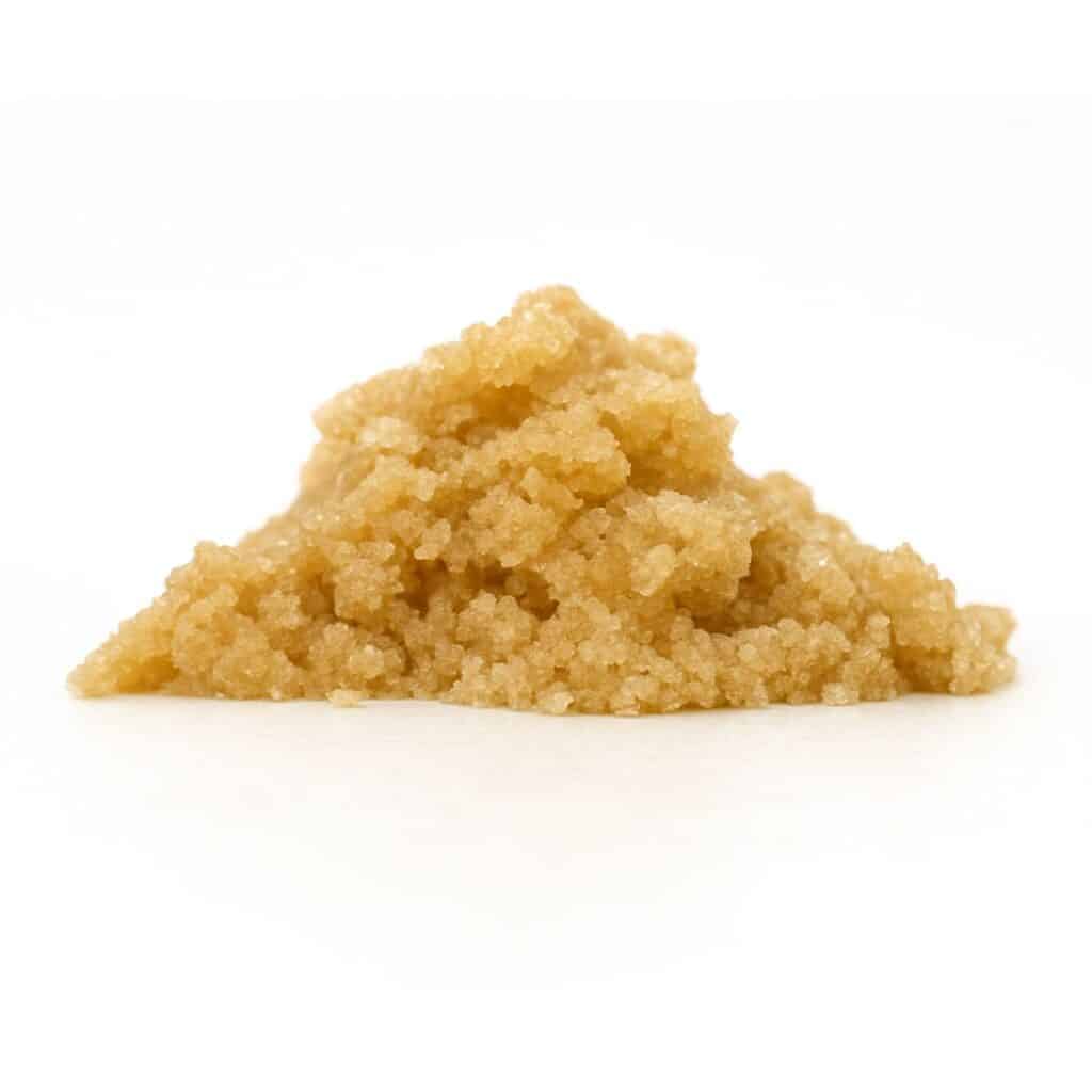 Light brown granular concentrate displayed in a small mound on a white background.