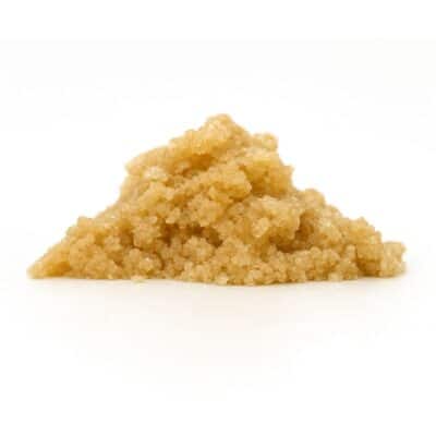 Light brown granular concentrate displayed in a small mound on a white background.
