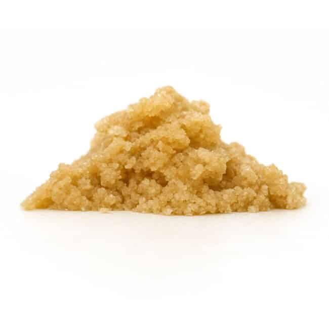 Light brown granular concentrate displayed in a small mound on a white background.