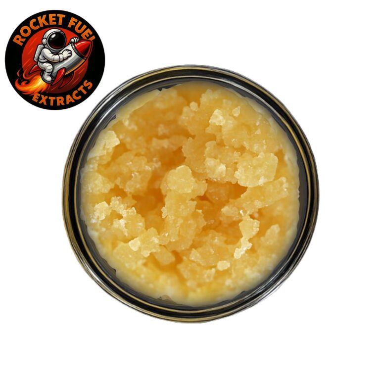 Rocket Fuel Extracts jar filled with golden-yellow cannabis concentrate featuring a crystalline texture, displayed on a clean white background with the brand’s astronaut logo in the top left corner.