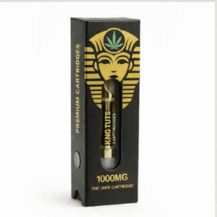 Black cannabis vape cartridge packaging with gold pharaoh-style logo and visible cartridge labeled 1000mg THC.