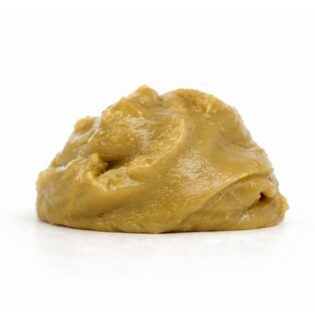 Close-up of a smooth, glossy light brown paste placed on a crisp white background, photographed with realistic depth and natural color balance.