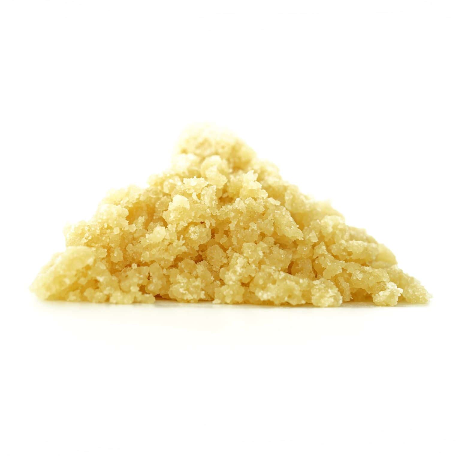 Golden cannabis sugar wax concentrate photographed on a crisp white background with visible crystal texture and natural depth