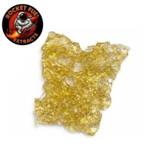 Golden cannabis shatter extract with translucent, glass-like texture on a crisp white background, Rocket Fuel Extracts logo visible in the corner