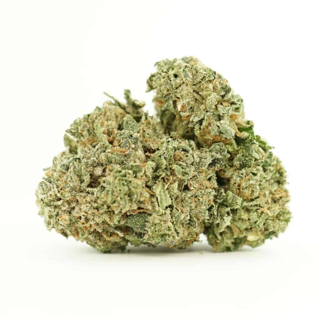 Close-up of a dried cannabis flower with dense green buds and visible orange pistils on a white background