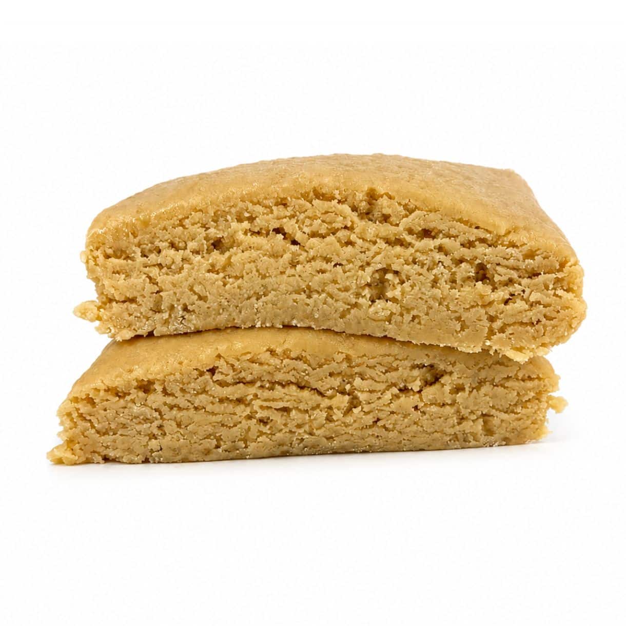 Premium light-golden cannabis concentrate with a smooth, dense texture, displayed as a sliced nug-style extract on a clean white background.