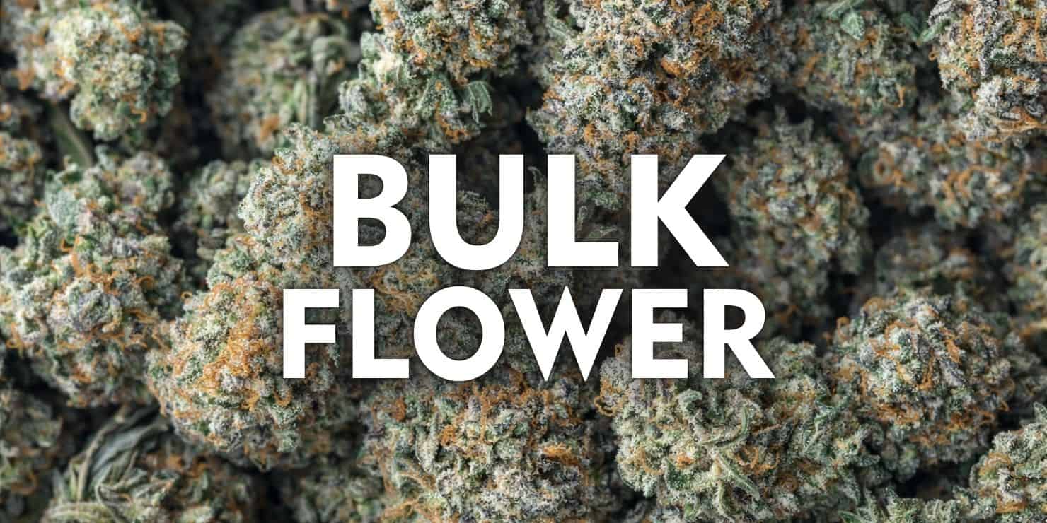 Bulk cannabis flower close-up with dense frosty buds and orange pistils, text overlay reading “BULK FLOWER” centered on image.