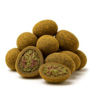 Close-up of round cannabis hash balls with one cut open to reveal a dense green and purple cannabis flower center.