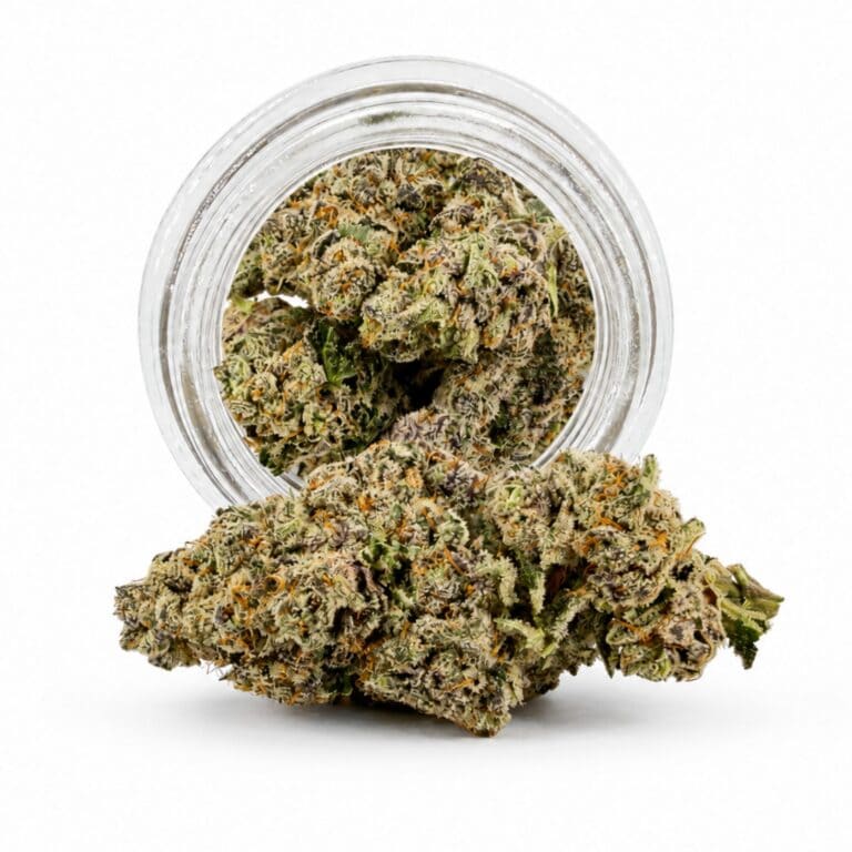 Dense cannabis flower with frosty trichomes in foreground, glass jar softly blurred on a crisp white background