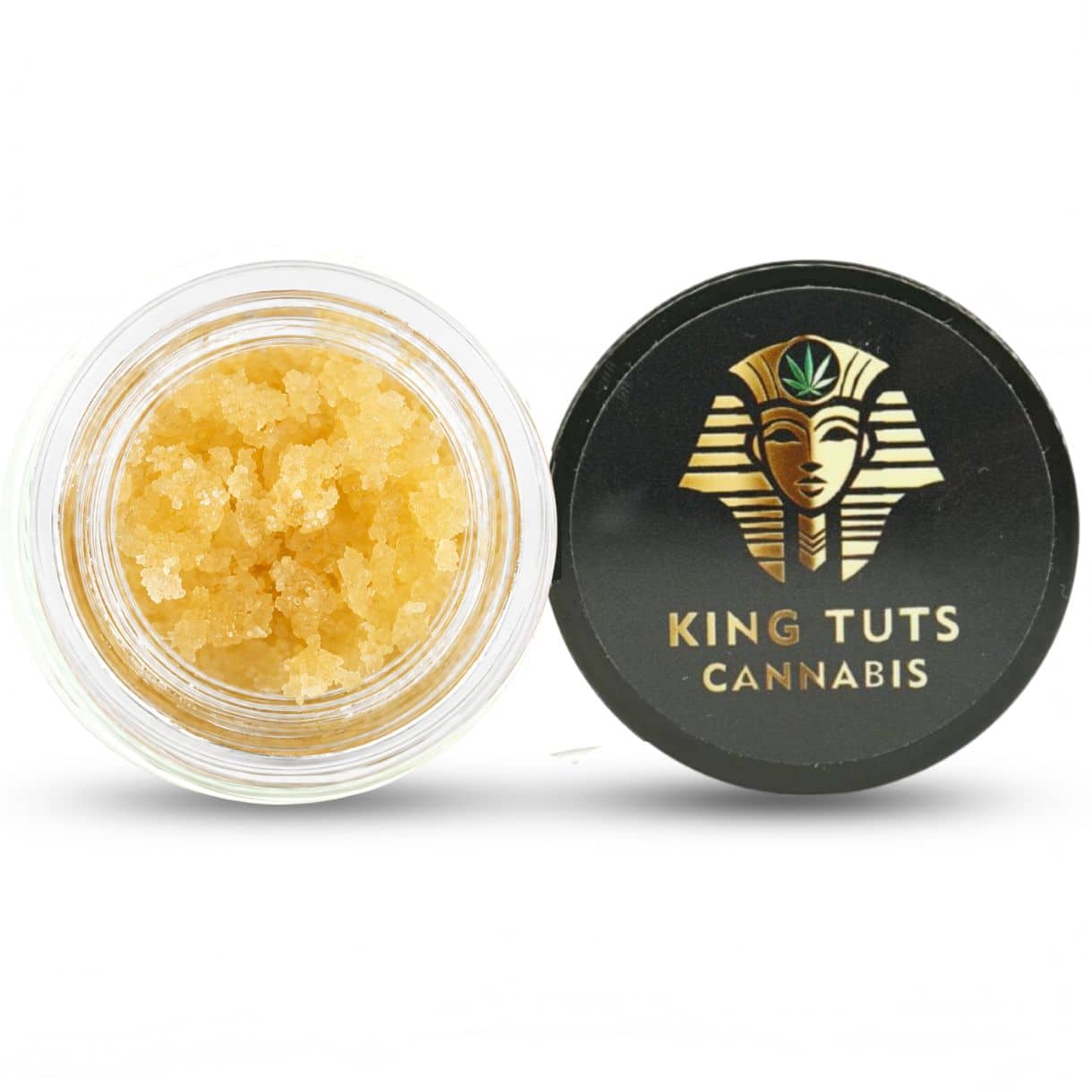redbull sugar wax in open container with golden crumble texture beside branded lid on white background